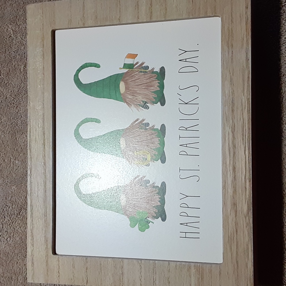 Rae Dunn wooden shelf decoration with gnomes.